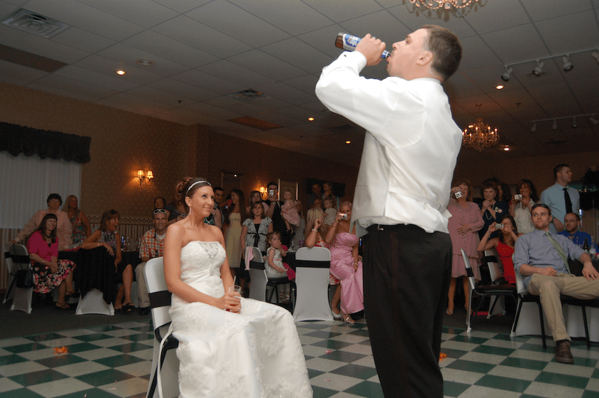 taking off the guarder at wedding reception