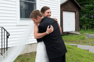groom hugs bride after seeing her for first time