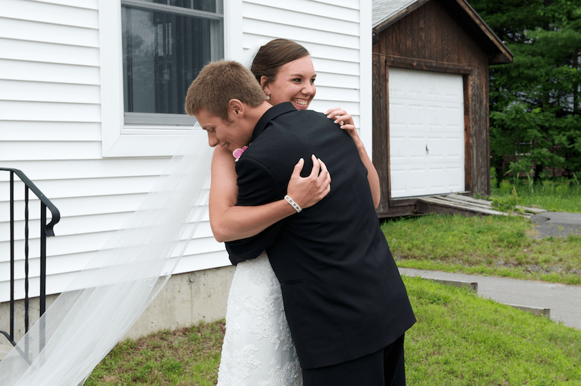 groom hugs bride after seeing her for first time