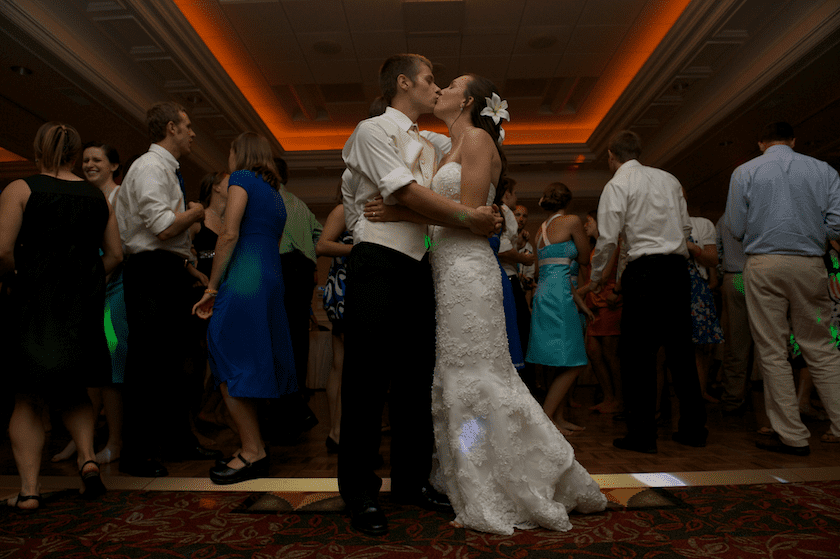 bride and groom kiss at Maine wedding reception
