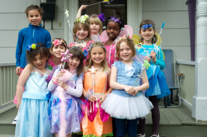 children on the front porch in their fairy costumes