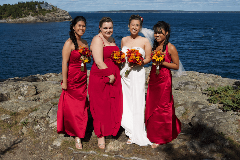 bridesmaids overlooking ocean in Maine
