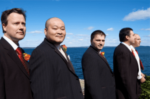 groomsmen overlooking ocean in Maine