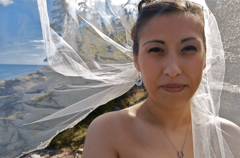 veil in face of Maine bride