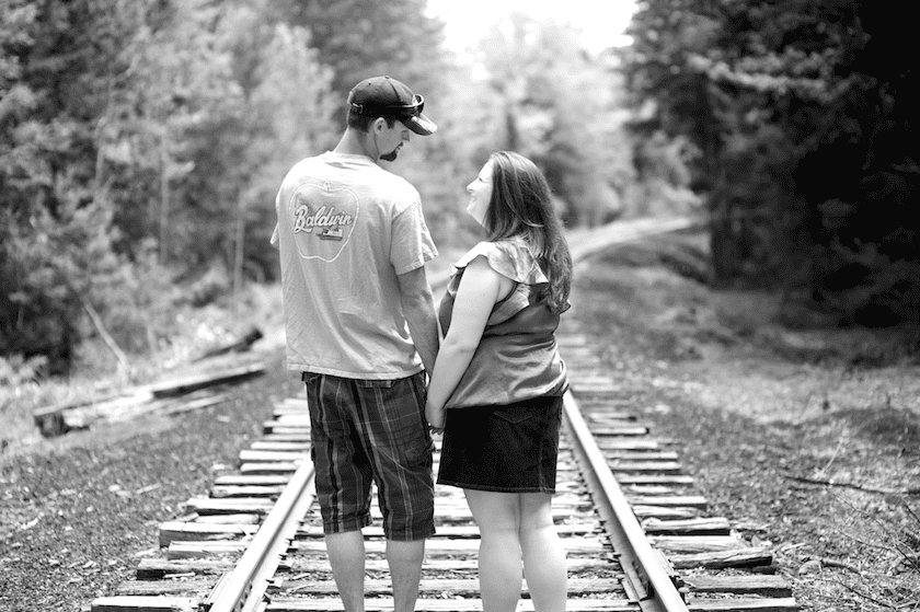 engagement photo on abandoned train tracks