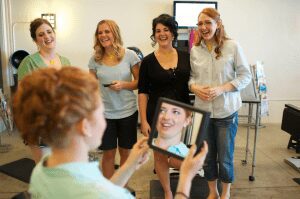 Maine bride with her bridesmaids at the salon