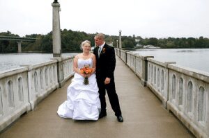Maine wedding bride and groom on footbridge