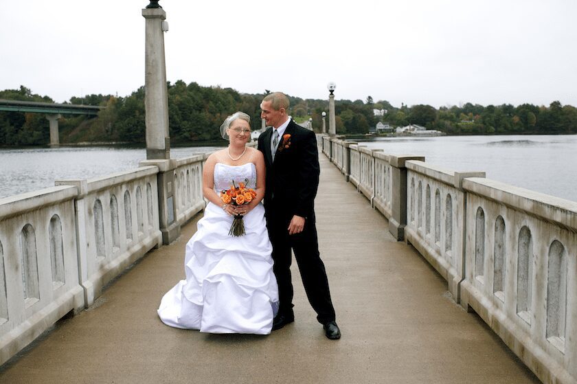 Maine wedding bride and groom on footbridge