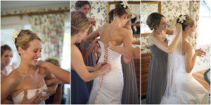 Maine bride putting on couture gown