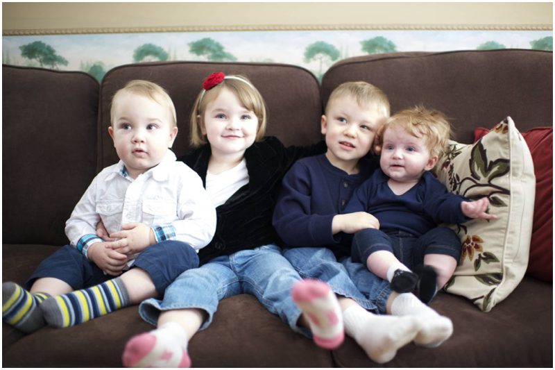 grandchildren on the couch for family photo by Maine family photographer Anne Schmidt