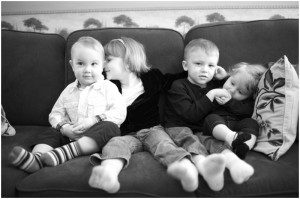 grandkids snuggle on the couch