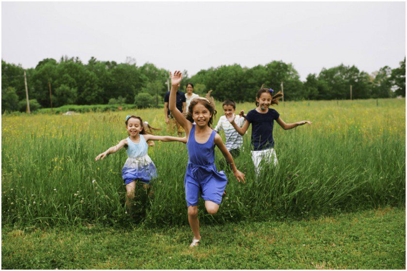 children running through the field