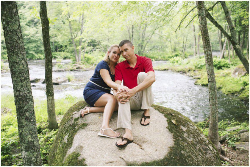 engagement photos on a rock by the river