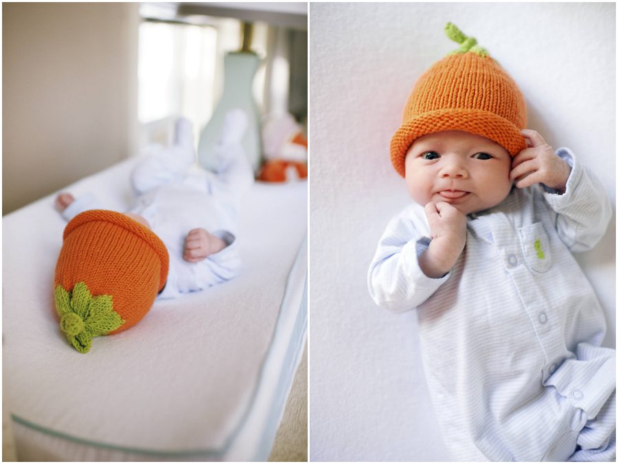 baby wearing pumpkin hat